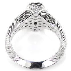 Platinum engagement ring with filigree and hand engraving.