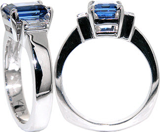 Emerald cut blue sapphire three stone engagement ring