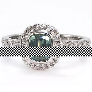 Beautiful bezel set green cushion cut sapphire engagement ring design.