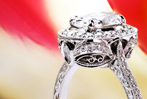 Antique styled halo engagement ring with oval center diamond in Honolulu