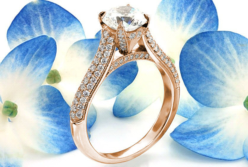 Rose gold engagement rings in Salt Lake City can come in make shapes and sizes, but this stunning rose gold design features a micro pave band with diamonds also set on the prongs.