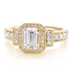 Art Deco engagement ring with emerald cut center stone and yellow gold setting in Oakland.