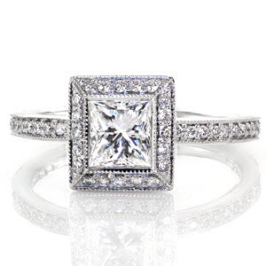 Bezel Elegante is a exquisite square halo design. The 0.75 carat princess cut is exaggerated in size with a halo of micro pavé diamonds framing it. The row of stones along the band magnify the beauty of the brilliant center. Raised high above the band, the halo leaves room for bands on either side.
