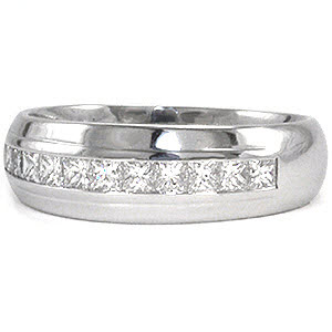 The Long Island band incorporates diamonds into a classic design. Crafted in 14k white gold, a single row of channel set princess cut diamonds total 0.75 carats embellish the top of the band. The domed profile has a single pinstripe that frames the diamonds. The high polished finish completes this classic look.