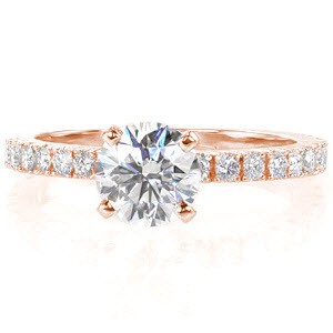 The Fascination design has the best of heirloom quality and elegant styling. The single 1.00 carat round brilliant cut center diamond is prominently placed within four stately prongs. Handcrafted from 14k white gold, the band has unique split bead prongs.