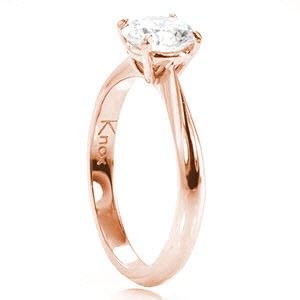 Solitaire engagement ring in Orlando with round brilliant diamond and rose gold setting.