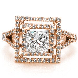 This geometric ring makes a grand statement with its luxurious double, square halos and split shank band. Both halos and the band are accented with micro pavé. The 1.00 carat princess cut center diamond is set in chevron prongs to protect the corners. This ring will dazzle with a prism of colors in any light!
