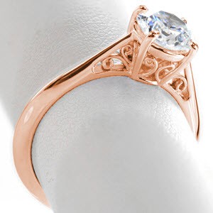 Custom engagement ring in Hudson with scroll filigree and round brilliant center stone.