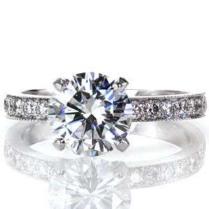Oakland engagement ring with a stunning round brilliant diamond center stone and pave band.