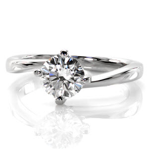 Philadelphia custom solitaire engagement ring with a round brilliant diamond held in a unique twisted setting.