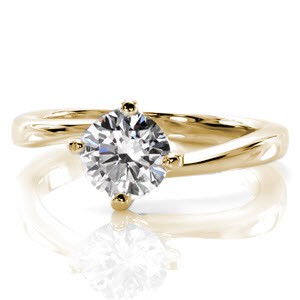 Rochester custom solitaire engagement ring with a round brilliant diamond held in a unique twisted setting.