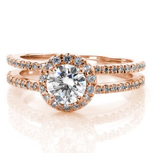 Delightful heirloom-quality, split shank engagement ring featuring a 0.60 carat round brilliant center diamond. The delicate halo around the center stone and both of the charming bands are detailed with micro pavé diamonds that will dance and twinkle in any amount of light.