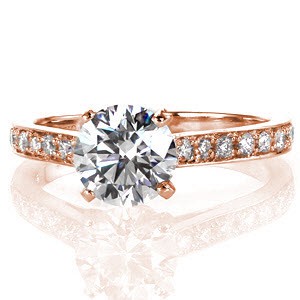 Mariposa is a magnificent design featuring a 1.25 carat round brilliant cut center diamond in a cathedral setting. The band is elegantly appointed with large micro pavé diamonds and it gracefully curves up to meet the raised center stone; the way light dances off of the diamonds is simply divine.