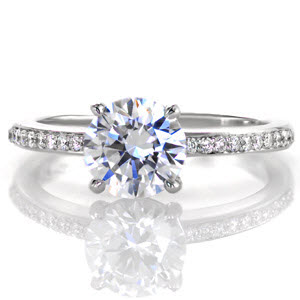 Micro pave engagement ring in Houston with round brilliant center stone and white gold setting.