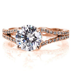 Bianca is a breathtaking design that puts all the focus on the 1.50 carat round brilliant cut center stone. The split shank band is detailed with micro pavé and these diamonds will dance and sparkle in any light. This ring is perfect for timeless elegance. 