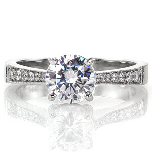 Arlington engagement ring with round brilliant center stone and diamond band.