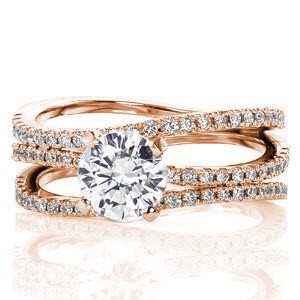 Fuego is a tantalizing design with a triple-split shank band. The 1.00 carat round brilliant cut center diamond is delicately set in a four prong setting which adds dimension to the piece. The three sections of the band are all tantalizing adorned with micro pavé; this wide band is simply exquisite!
