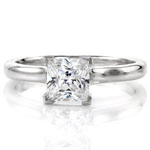 Sedona Solitaire is a modern engagement ring with the contemporary 1.00 carat princess cut center stone. The smooth polished cathedral contours up towards the diamond, giving the band dimension and style. The V-shaped chevron prongs protect the edges of this square diamond and adds an element of design. 