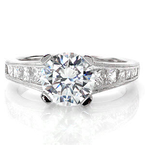 Custom engagement ring in Oakland with round brilliant center stone and channel set princess cut side stones.