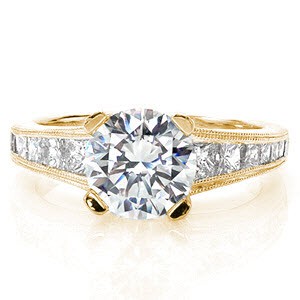 Engagement ring in St. Cloud with round brilliant center stone and channel set princess cut diamonds.