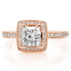 Maui is a unique halo design featured with a 0.80 carat princess cut. The V-tip prongs safely secure the square edges of the center stone while adding a pleasing design element. micro pavé diamonds line each side of the band and frame a square halo around the princess cut for a mesmerizing sight. 