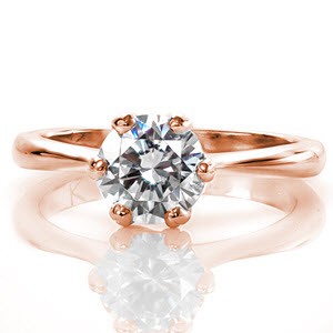 Intricate woven prongs form the signature Lattice design. The six detailed prongs capture a 0.80 carat round brilliant cut center diamond.  The arched shoulders join the prong basket which elegantly rests upon a delicately tapered band in 14k white gold.