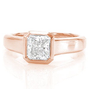 Cashmere is a luxurious design featuring a 1.0 carat radiant cut diamond. The mirrored bezel securely and precisely borders the dramatic octagonal lines of the stone. The wide band tapers to the bottom, giving importance to the brilliant center. Triangular open pockets add dimension and character to the side of the band.   