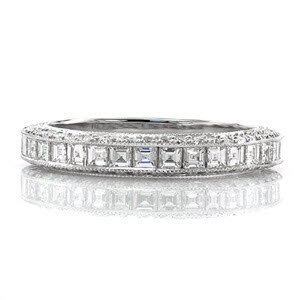 A sensational design made to match the Passion Engagement Ring. A mix of diamond shapes create a refined statement that stands out when worn on its own. The top of the band is channel set with carre cut stones with descending step-cut facets. The sides radiate with brilliance from the round cut diamonds.