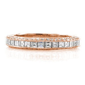 A sensational design made to match the Passion Engagement Ring. A mix of diamond shapes create a refined statement that stands out when worn on its own. The top of the band is channel set with carre cut stones with descending step-cut facets. The sides radiate with brilliance from the round cut diamonds.