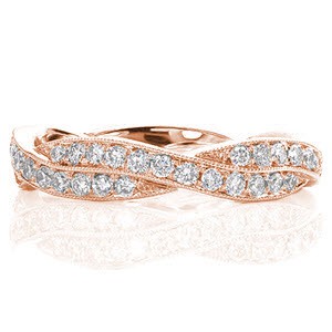 Our Lalana design gracefully weaves two micro pavé diamond bands into one throughout the whole ring. The round cut diamonds are bead set by hand and total 0.50 carats.  Crafted in 14k white gold, the two band edges are finished with hand applied milgrain detail.