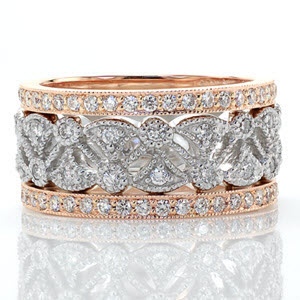 This enchanting right hand ring is a two-tone piece using 14k white and rose gold. The pattern consists of fan shaped cut-outs accented with diamonds and bordered by two bands of micro pavé. The rose gold side bands add subtle color for a beautiful contrast from the white of the diamonds.