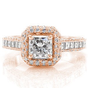 This stunning micro pavé ring contains a 0.75 carat princess cut center stone enveloped in a double row diamond halo. The channel set carrÃ© cut side stones add a linear balance to the diamond sparkle visible on all sides. The design has hidden filigree curls on the inside for extra decadence. 