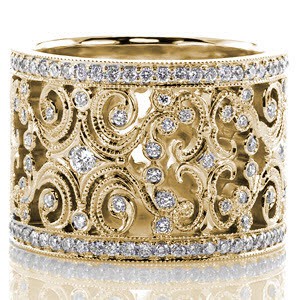 Custom wide band ring in New Haven with an intricate pattern of scrolls and bezel set round diamonds bordered by diamond rails.