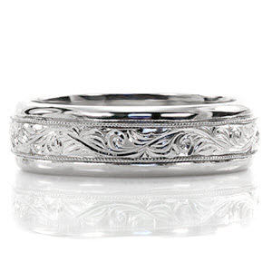 The Hand Engraved North Shore ring is designed for comfort and style. The domed band is adorned with hand engraved scroll work and framed with a milgrain edge. Crafted in 14k white gold, the clean high polished outside edges highlight the intricate details.