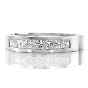 The Princess Cathedral band frames eight princess cut diamonds with a total of 0.45 carats. Crafted in 14k white gold, the channel set band is finished with a smooth high polish shine. The substantial band slightly tapers at the bottom for utmost comfort.