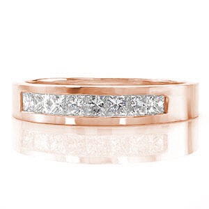 The Princess Cathedral band frames eight princess cut diamonds with a total of 0.45 carats. Crafted in 14k white gold, the channel set band is finished with a smooth high polish shine. The substantial band slightly tapers at the bottom for utmost comfort.