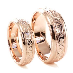 Hand Engraved Rose Gold wedding bands in Honolulu with scroll pattern.