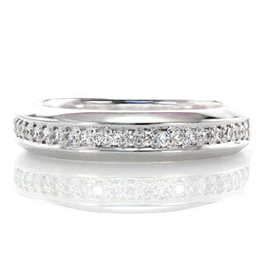 The River Band is a classic wedding band designed to pair with the River engagement ring. The row of micro pavé diamonds that flows through the middle of the band is offset perfectly by the luster of the high polished metal. The edges of the band are slightly beveled to create dimension and comfort. 