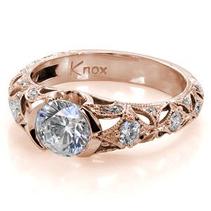 Rose gold engagement ring in Boston with intricate setting and half bezel center stone.