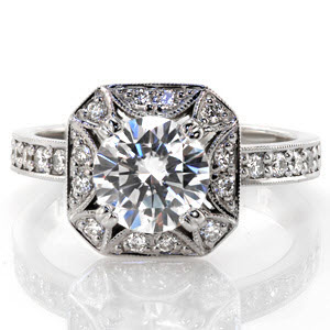 Unique vintage engagement ring designs in Sioux Falls. This stunning halo design features a unique star burst cut out around the center stone. The remainder of the halo is set with micro pave diamonds. The micro pave band completes the look of this gorgeous diamond engagement ring.