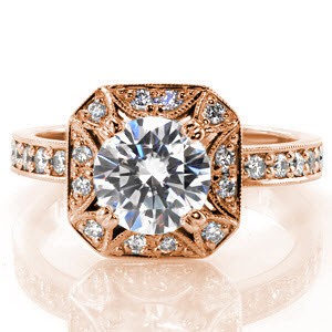 Lotus, features a unique square halo with clipped corners. The exquisite detail of half-moons accented with micro pavé diamonds surround the 1.25 carat round diamond. The elevated halo rests high for a sophisticated style and to allow for bands to sit flush on either side of the ring.