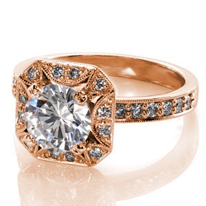 Antique inspired custom rose gold engagement ring in Milwaukee with a unique pierced diamond halo surround the round diamond center stone.
