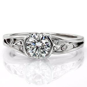 Filigree engagement ring in Forth Worth with half bezel center stone and white gold setting.