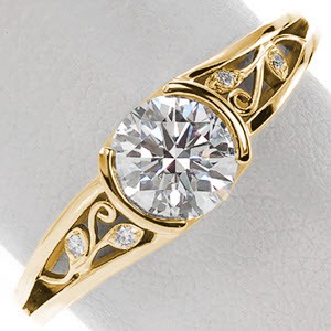 Unique engagement ring in Ottawa with nature inspired filigree, diamonds and round center stone.