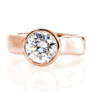 Twilight is a sophisticated engagement ring. The thick contemporary bezel contours the round outline of the 2.0 carat center stone. Set far above the mounting, the heightened cathedral displays the acclaimed profile of a round brilliant. The polished 14k white gold glistens from every angle.      