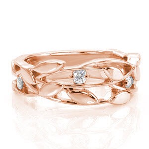 Unique rose gold wedding rings in Fort Worth, Texas. This beautiful organic design features a few small, round brilliant cut diamonds set among leaves and vines.