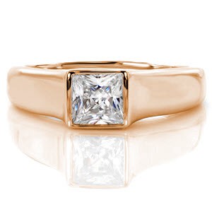 A full bezel setting gives the Apollo design signature style. The 14k white gold band fully surrounds a 0.75 carat princess cut diamond, outlining its square shape and linear faceting. The high polished band tapers towards the bottom for comfortable fit.