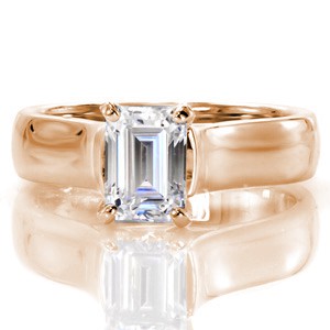 The 1.0 carat emerald cut is displayed high above the mounting for a dramatic statement. Long parallel facets gives the affect that the diamond goes on forever. The contoured swoop of the cathedral band places emphasis on the center stone. The luster of the white gold metal enhances the brilliance of the emerald.     