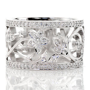 Filigree wedding band in Montreal with nature inspired patterns between diamond bands.