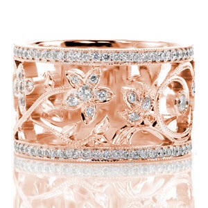 Rose gold wide band in Oakland with nature inspired patterns between diamond bands.